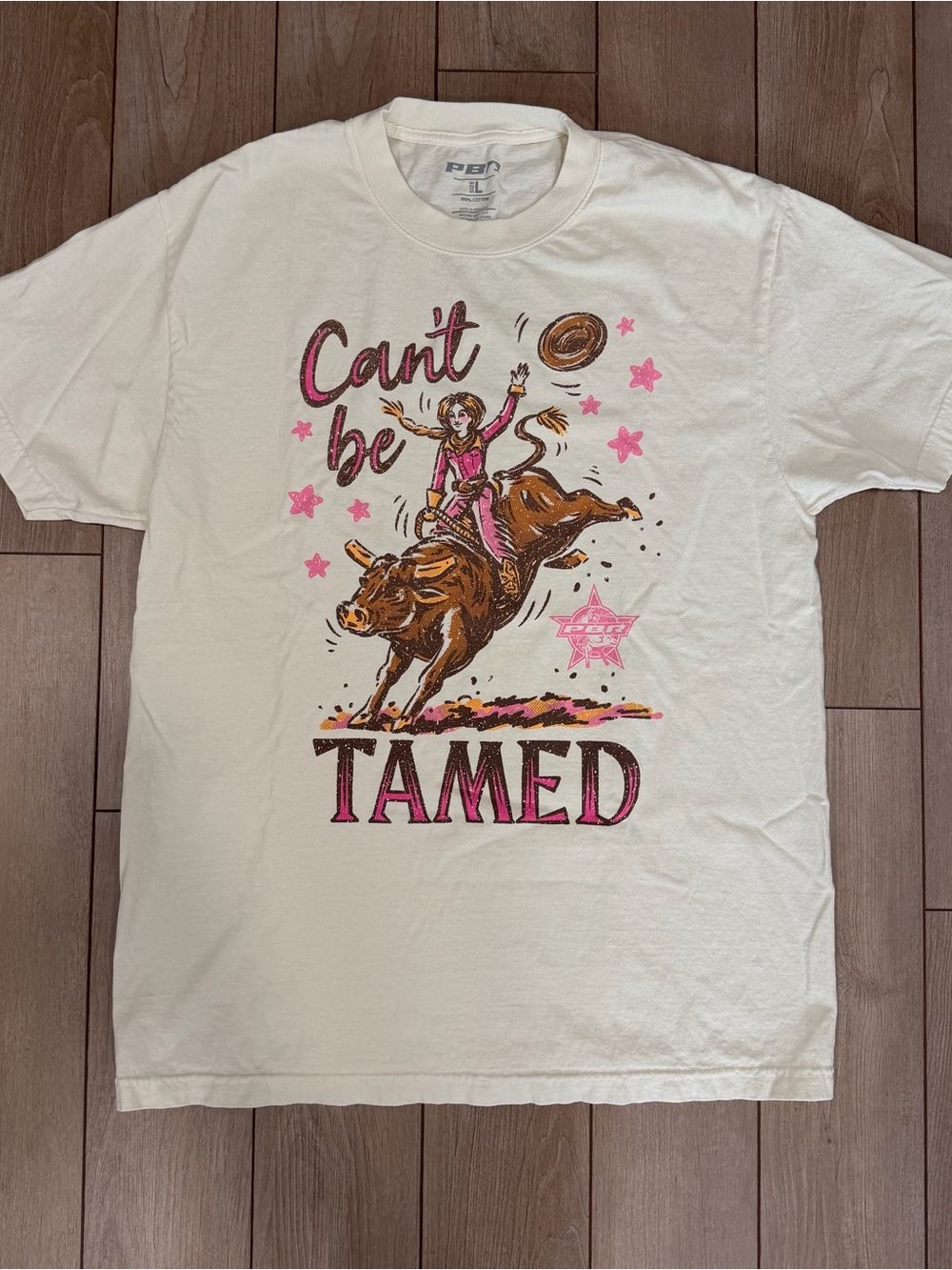 PBR ‘Can't Be Tamed' Womens cowgirl Graphic Tee - Pink & Cream